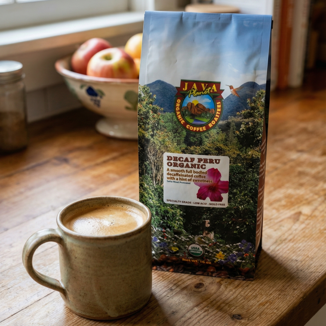 Decaf Peru Organic coffee bag beside a brewed cup